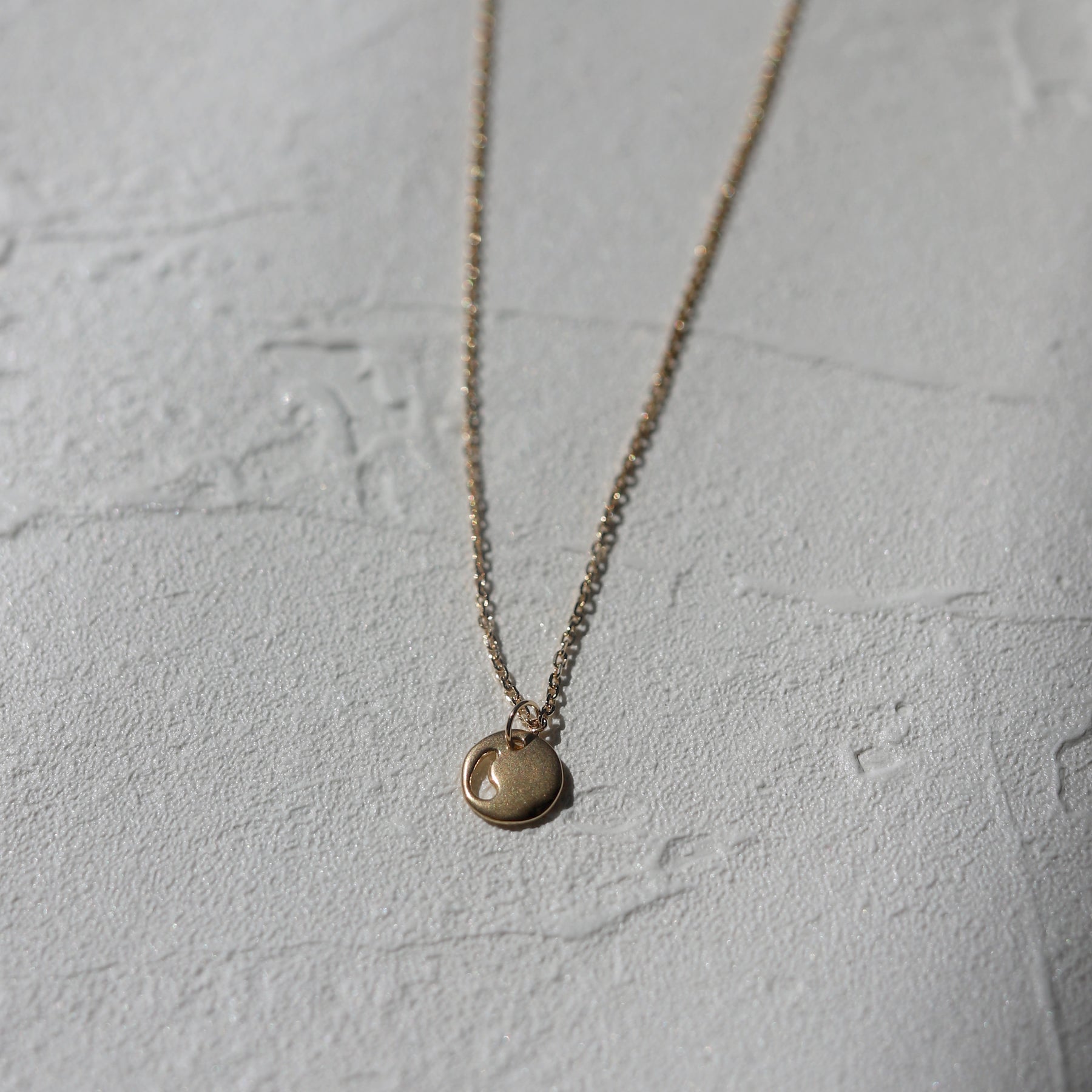 K18 pluto necklace