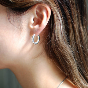 interpose earrings